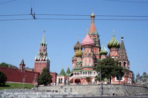 St Basil's Cathedral with colorful domes, Spasskaya Tower and red Kremlin walls, Moscow
