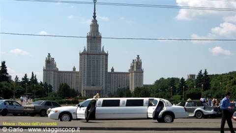 White limousine with open doors in front of Moscow State University