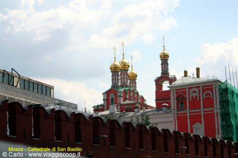 Red Kremlin walls and golden church domes in Moscow