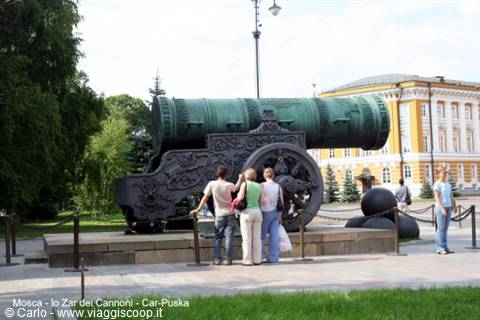 Tourists admire the huge bronze Tsar Cannon near the Kremlin in Moscow