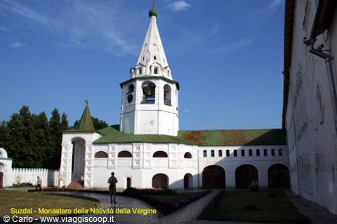 Suzdal, white bell tower of the Nativity Monastery under a blue sky