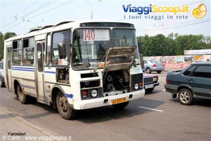 City bus with open hood on a street in Yaroslavl