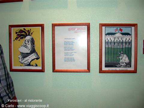 Three framed prints on a light green wall at Yaroslavl restaurant