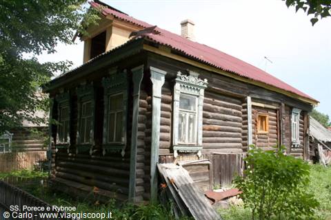 Rustic carved log house with blue-framed windows, Suzdal, Golden Ring