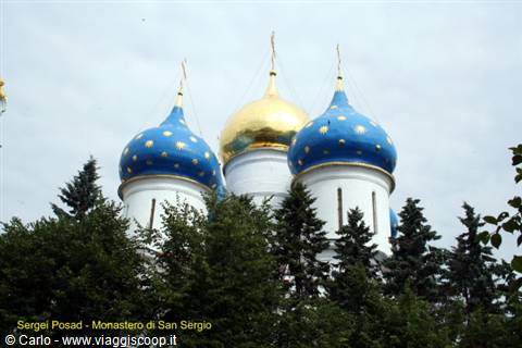 Sergiev Posad: blue and golden onion domes of St Sergius monastery among firs