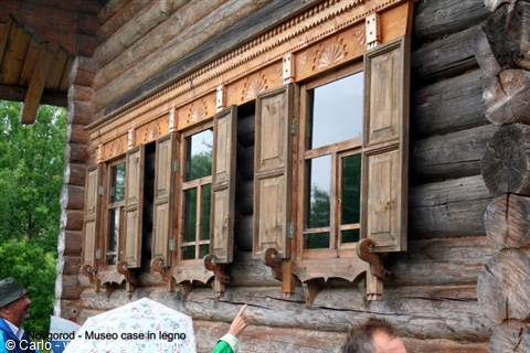 Log facade with carved wooden shutters at the Nizhny Novgorod wooden architecture museum