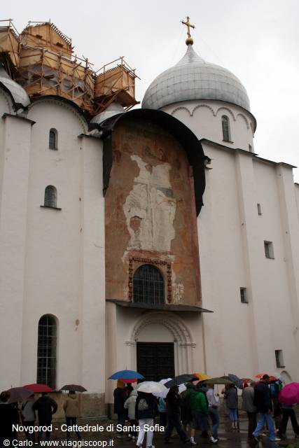 Tourists with umbrellas in front of Saint Sophia Cathedral in Novgorod