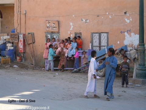 Children in front of a mud-brick house, Siwa Oasis