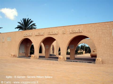  Italian War Memorial at El Alamein, stone wall with arches, palm tree and cannon