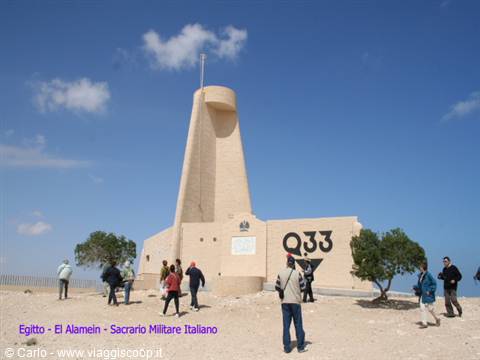 Visitors around the concrete tower of the Italian War Memorial at El Alamein