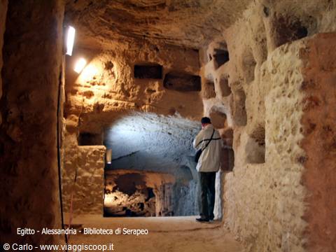 Man in rock-cut tunnel, Serapeum library, Alexandria
