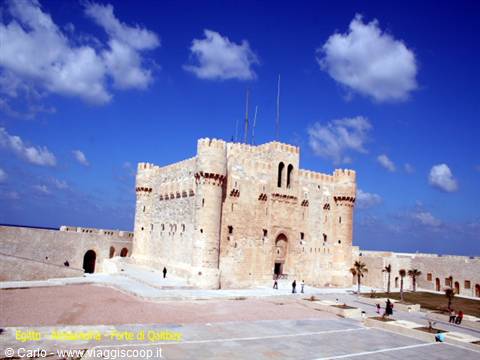 Qaitbay Fortress in Alexandria, pale stone walls under a blue sky