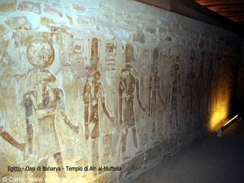 Ancient Egyptian painted deities on limestone wall, Ain al-Muftella Temple, Baharya Oasis