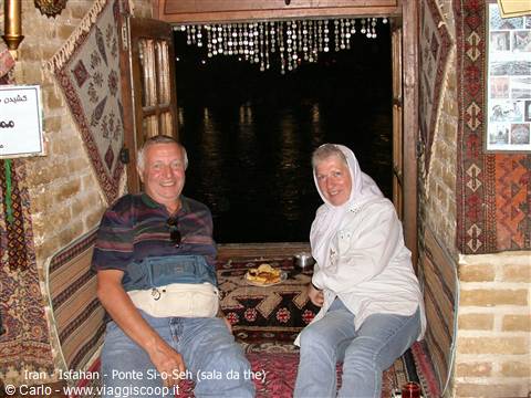 Couple sitting in the teahouse of Si-o-Seh Pol bridge, Isfahan