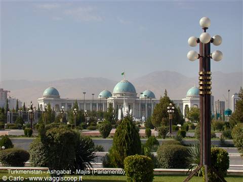 The Majlis parliament in Ashgabat, turquoise domes among gardens and mountains