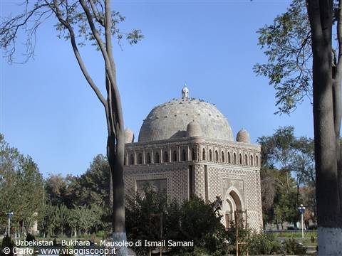 Ismail Samani Mausoleum in Bukhara, woven brickwork amid green trees