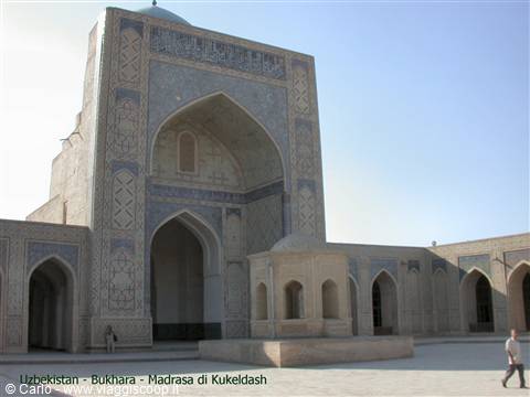 Kukeldash Madrasa in Bukhara: brick portal with blue mosaic tiles and inner courtyard