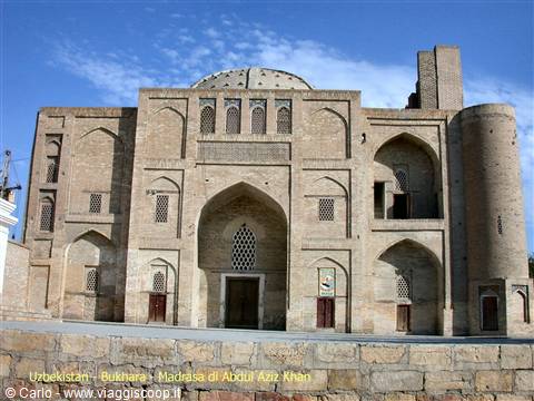Abdul Aziz Khan Madrasa, Bukhara: brick facade with dome and portal