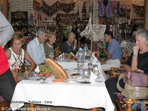 Dinner in a Bukhara restaurant among hanging textiles and ceramics