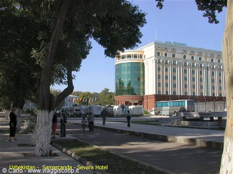 President Hotel in Samarkand, white facade and green glass among trees