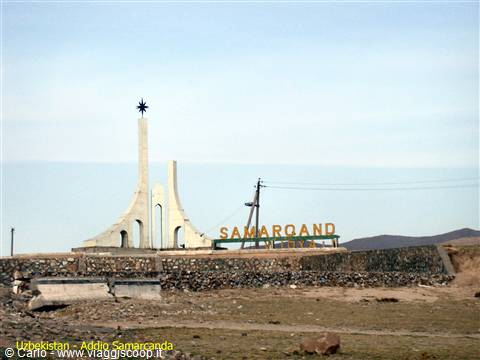 White star-topped monument and Samarkand sign at the city entrance