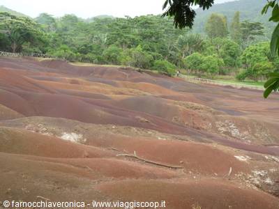 Seven Coloured Earths of Chamarel, red sand dunes surrounded by greenery