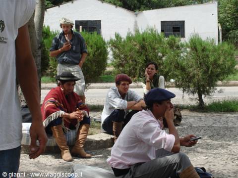 The Fiesta is over: tired, they wait for the bus to return to everyday life.