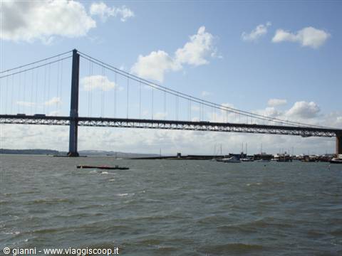 Forth Road Bridge suspension bridge over the Firth of Forth, cars crossing, moored boats
