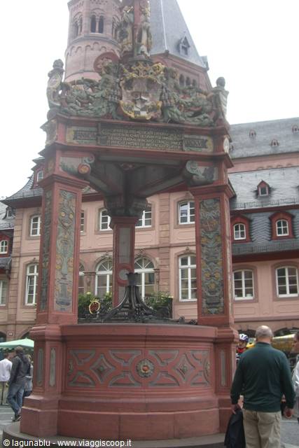Historic red stone fountain with statues, Mainz market square