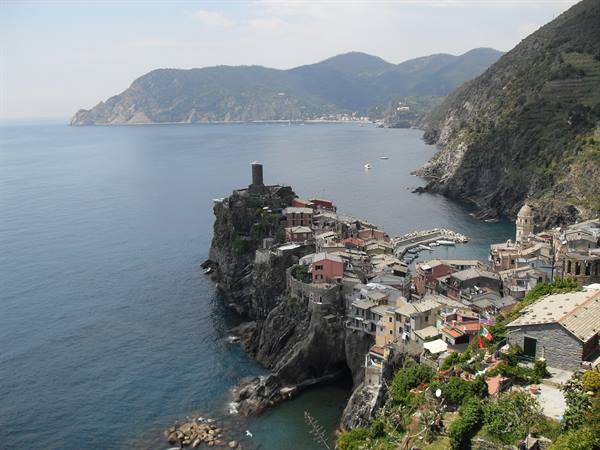 Vernazza: colorful houses on the cliff with Doria tower above the harbor