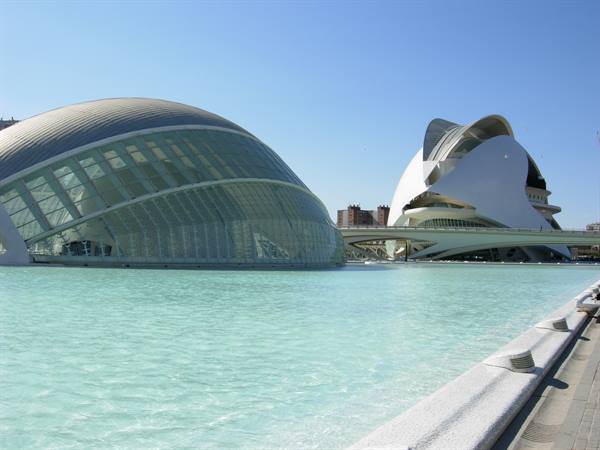 Calatrava's glass dome and white concrete mirrored in the Ciudad de las Artes pool