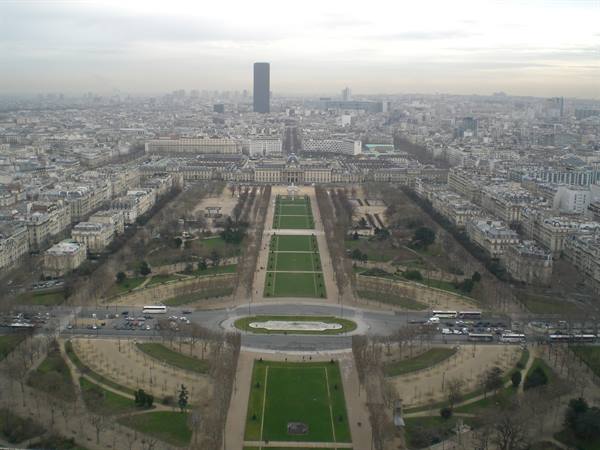 Champ de Mars gardens and Montparnasse Tower, Paris under grey sky