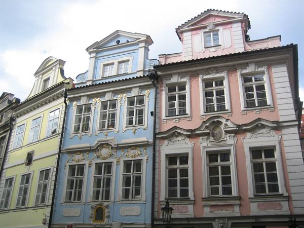 Pastel baroque facades in yellow, blue and pink, Prague, soft daylight
