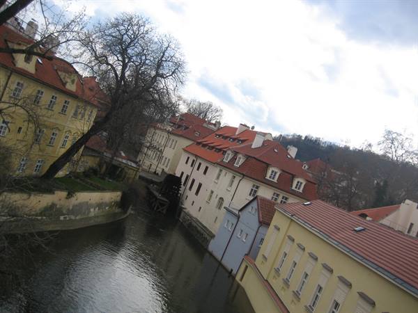 Colorful houses with red roofs along the Čertovka canal, Prague