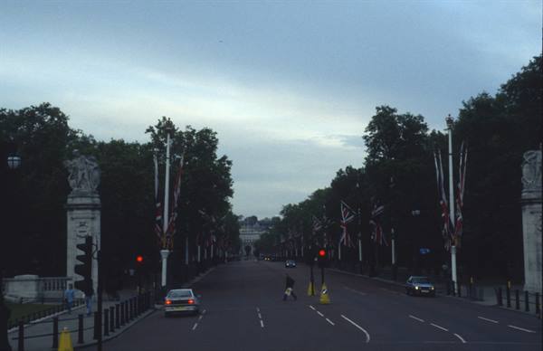 The Mall toward Buckingham Palace, Union Jack flags on lampposts at dusk