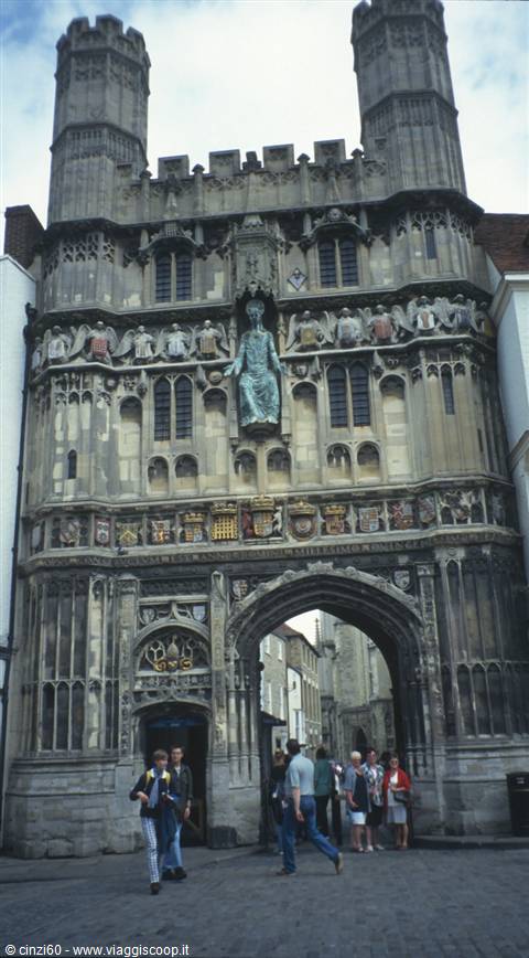 Christ Church Gate in Canterbury, Gothic stonework with gilded statue and tourists