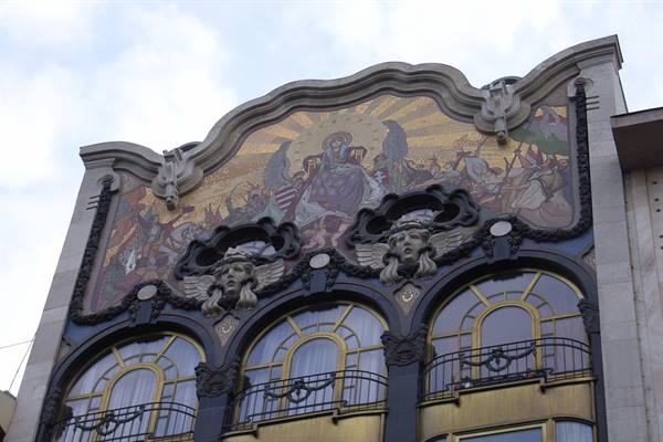 Golden mosaic with angelic figures above Art Nouveau windows of Török Bank building, Budapest