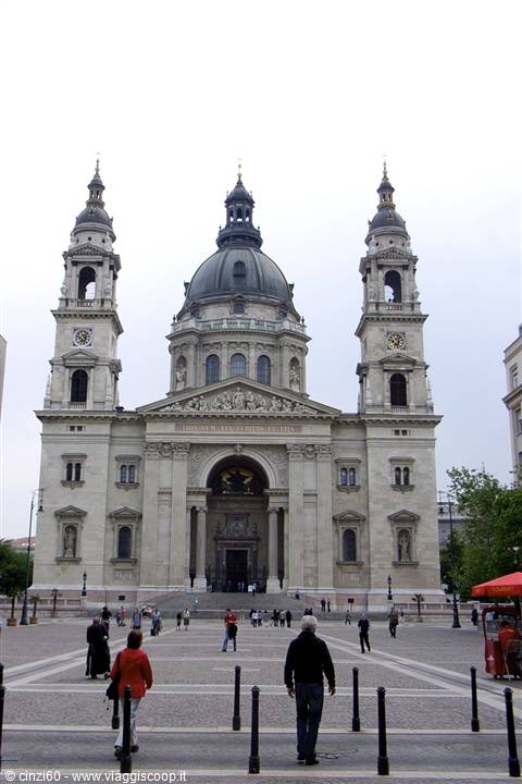 Tourists walk across the square in front of St. Stephen's Basilica in Budapest
