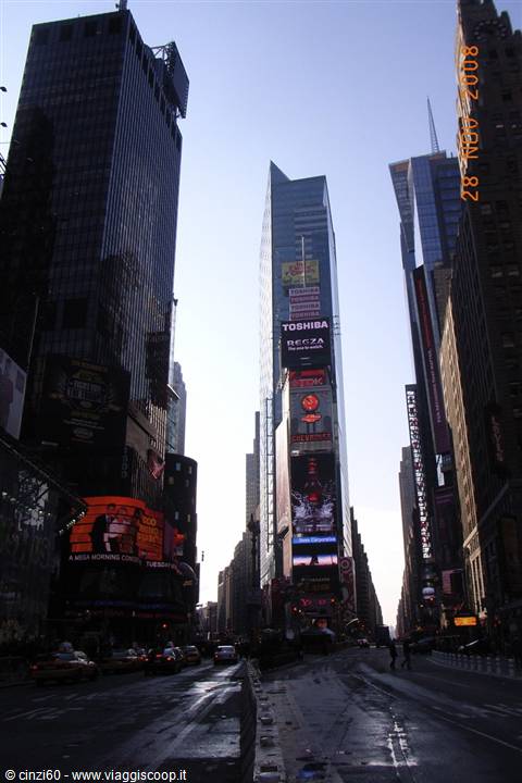 Times Square, New York: skyscrapers with Toshiba signs, traffic at midday