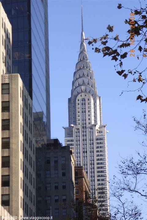 The stainless steel spire of the Chrysler Building among New York skyscrapers