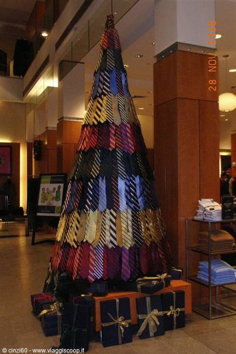 Christmas tree made of colorful neckties in a mall, with gift boxes