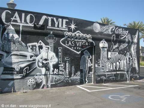Black and white mural with vintage Las Vegas signs, classic cars and Elvis