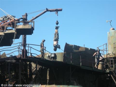 Stuntman hanging from a crane during a live action show