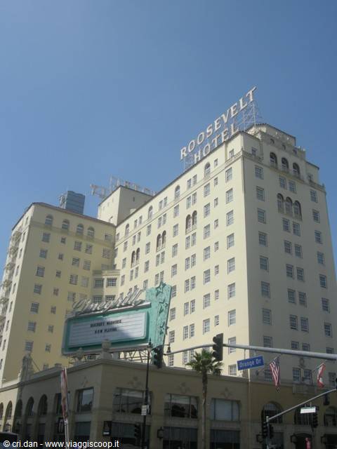 The Roosevelt Hotel in Hollywood, pale facade against blue sky, rooftop sign