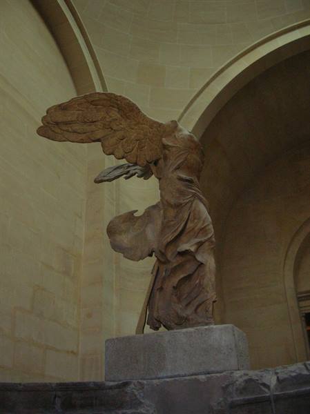 Winged Victory of Samothrace, headless marble statue on the Louvre staircase