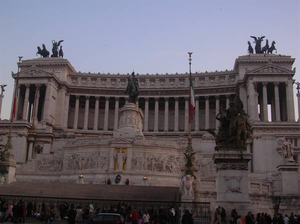 The Vittoriano monument in Rome, white marble with equestrian statue and Italian flag