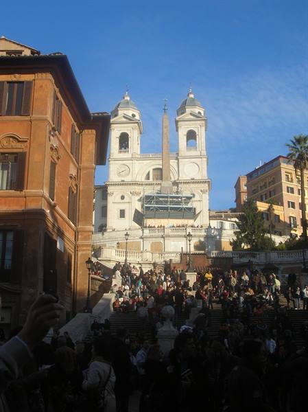 Crowd on the Spanish Steps in Rome under a blue sky