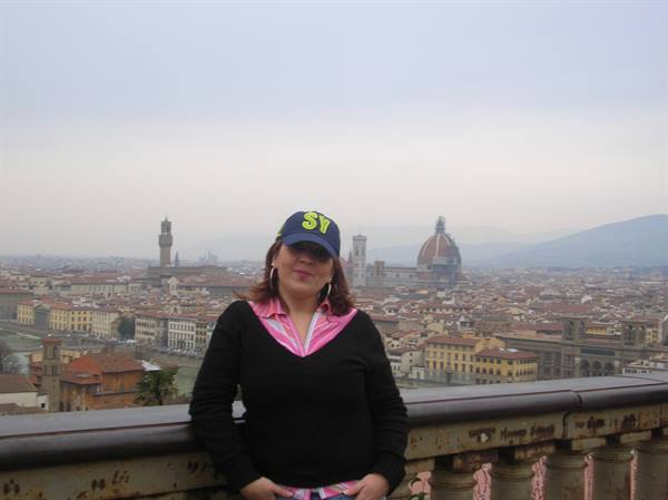 Woman in blue cap at Piazzale Michelangelo, Florence, with the Duomo behind