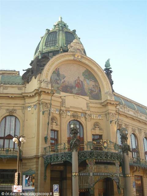 Art Nouveau facade of Prague's Municipal House with green copper dome and mosaic