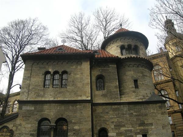 Klausen Synagogue in Prague, rough stone, red tiled roof, round tower